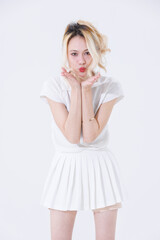 Asian confident attractive beautiful young woman blonde hair tied stand wearing white shirt top mini skirt sport background studio, portrait lifestyle fashion outfit trendy style pose look at camera.