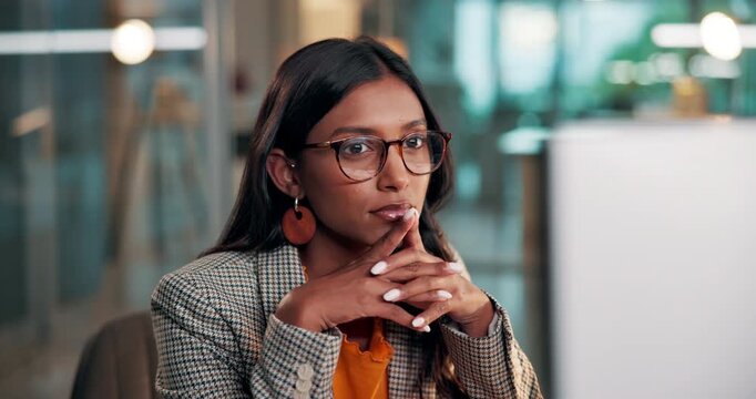 Reading, desktop or woman in office with thinking, draft edit or source feedback for article. Bokeh, glasses or Indian journalist in agency with tech, fact check or industry research for publication