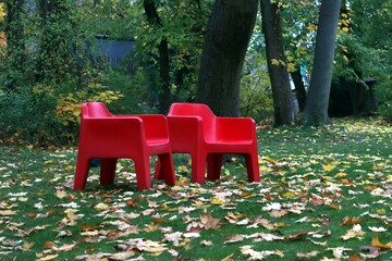 Red outdoor chair in garden