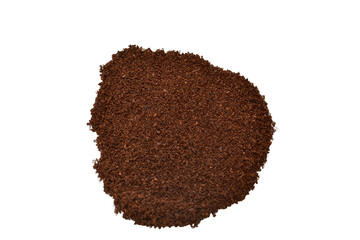 Ground black coffee lies in a pile on a white background.