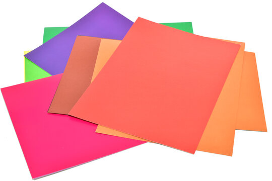 Sheets of multi-colored cardboard lie on a PNG background.