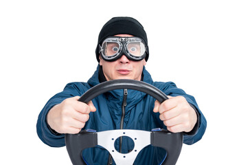 Front view of a man wearing motorcycle goggles, blue jacket and black beanie, tightly holding a steering wheel with a surprised look. PNG image on a transparent background.