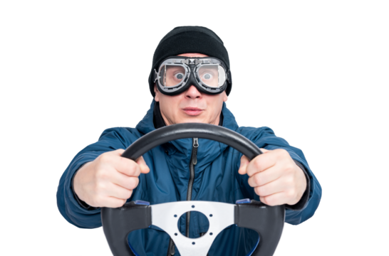 Front view of a man wearing motorcycle goggles, blue jacket and black beanie, tightly holding a steering wheel with a surprised look. PNG image on a transparent background.