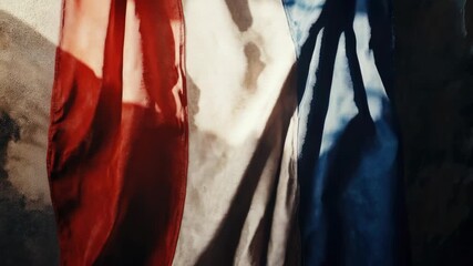 Video A red, white, and blue flag hangs on a wall, with a simple and classic design