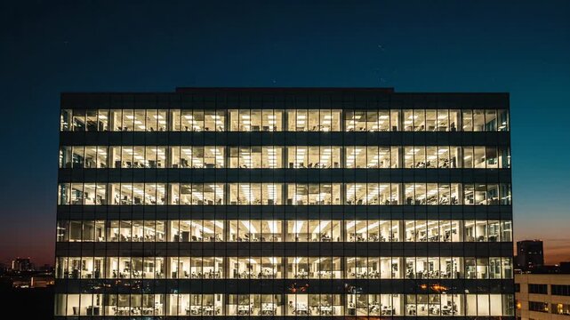 Evening Office Building Reflects Twilight City Lights.