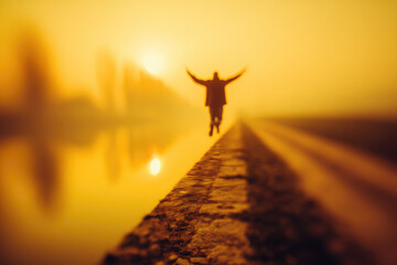 Blurred man stretching arms on riverside path at sunrise, surreal minimal scene with warm golden light, peaceful morning atmosphere, soft focus, outdoor solitude