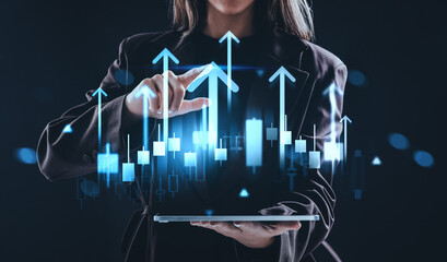 Businesswoman analyzing digital stock growth chart with rising a
