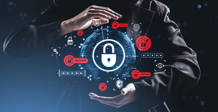 Cybersecurity data protection concept with lock symbol surrounded by digital warnings and icons held by hands on a futuristic abstract background.