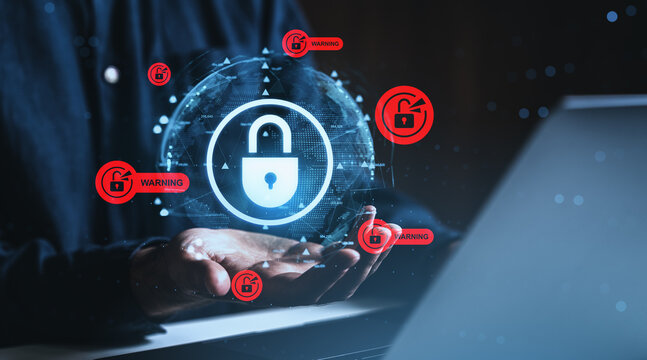 Cybersecurity breach warning concept with digital padlock and alert icons floating above hands in creative background with modern technology elements.