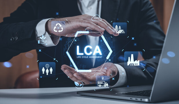 Businessman showing LCA Life Cycle Assessment concept with digital ecology and sustainability icons on futuristic interface over office background..