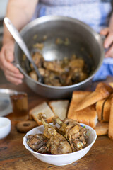Countryside Cooking Scene. Elderly Woman Preparing Classic Homemade Meals Outside. Grandma Making Traditional Family Dishes. Rural Heritage Cuisine in Moldova.