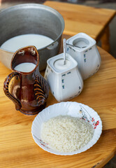Countryside Cooking Scene. Elderly Woman Preparing Classic Homemade Meals Outside. Grandma Making Traditional Family Dishes. Rural Heritage Cuisine in Moldova.