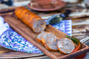 Countryside Cooking Scene. Elderly Woman Preparing Classic Homemade Meals Outside. Grandma Making Traditional Family Dishes. Rural Heritage Cuisine in Moldova.
