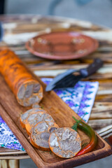 Countryside Cooking Scene. Elderly Woman Preparing Classic Homemade Meals Outside. Grandma Making Traditional Family Dishes. Rural Heritage Cuisine in Moldova.