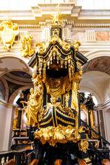 Obraz premium Ornate Baroque gilded pulpit in the shape of a ship in the basilica of Benedictine abbey of Tyniec, Krakow, Lesser Poland, Poland, Europe