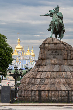Famous historic bronze monument to Bohdan Khmelnytsky stands on Sofia Square against the golden domes of St Michael's Monastery in Kyiv Ukraine creating a classic city landmark view
