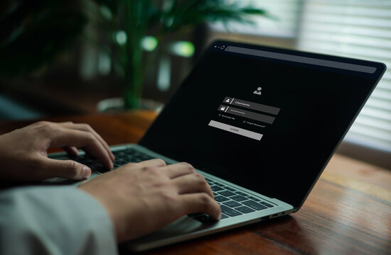 A user typing on a laptop displaying a digital login interface, representing cybersecurity, account access, data protection, secure authentication, and modern online system entry in a professional.