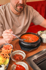Traditional Korean kimchi jjigae soup in a Korean restaurant. Asian food.