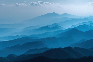 Layered Blue Mountain Ranges with Mist Under a Partly Cloudy Sky in Daylight Landscape Scenic Vista Serene Blue Landscape Majestic Mountain Layers