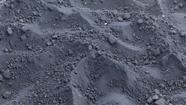 Gray rocky terrain rugged ground stone surface.