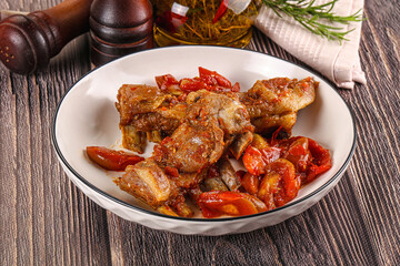 Baked lamb ribs with vegetables