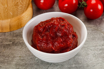 Red tomato paste in the bowl