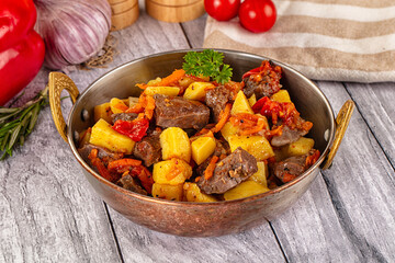 Rogiut with meat, potato and tomatoes