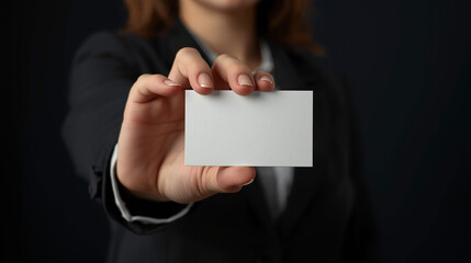Naklejka premium Blank White Business Card Held by Woman for Contact Information Display