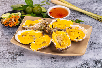 Baked oyster with cheddar cheese