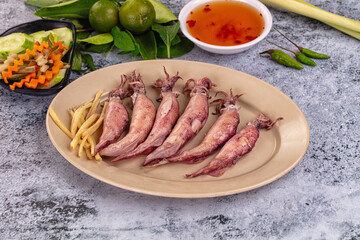 Boiled wild mini calamari snack