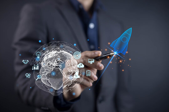 A businessman pointing at a glowing digital rocket and global network icons, symbolizing innovation, worldwide technology growth, startup acceleration, and advanced business transformation.