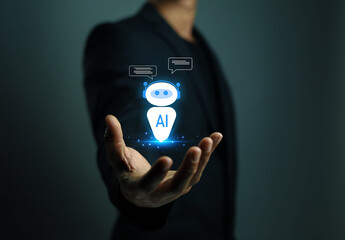 A professional presenting a bright AI chatbot hologram floating above their hand, representing digital intelligence, virtual assistance, and modern technology used for smart communication.