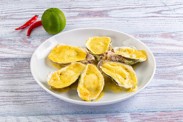 Baked oyster with parmesan cheese