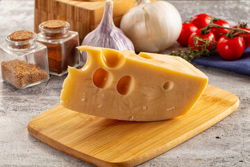 Yellow maasdam cheese triangle piece