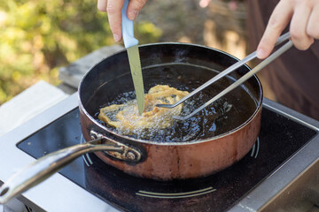 Artisan chef making authentic homemade biscuits following old Moldovan recipes. Heritage baking scene. cozy rural kitchen