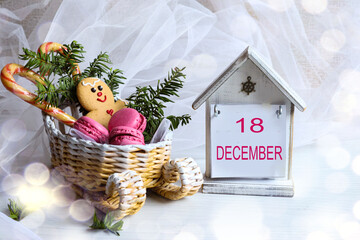December 18 Calendar: The number 18 and the month "December" in English on a decorative calendar next to a sleigh
