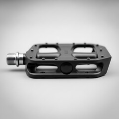 Black Bicycle Pedal Isolated on a Light Gray Background Studio Shot.