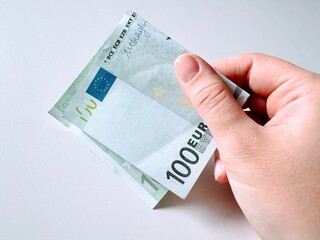 Hands with money on a white background