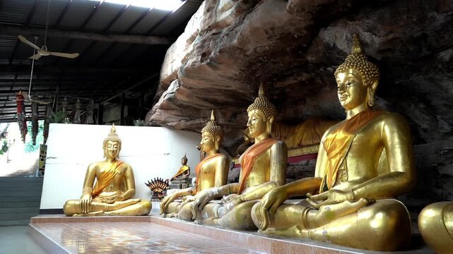 Worshipping Buddha Statue at Tham Khuha Sawan Temple with Peaceful Sacred Atmosphere , 22 November 2025 , Thailand.