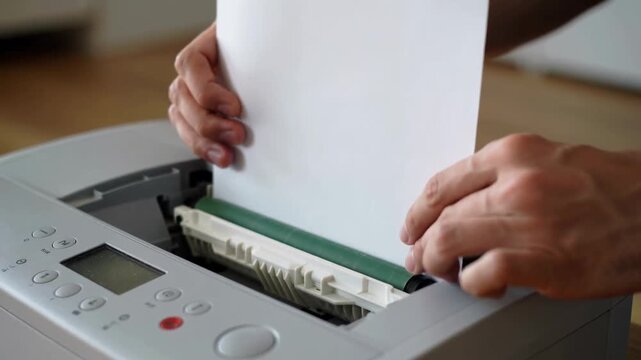The image shows a close-up of a working paper shredder.