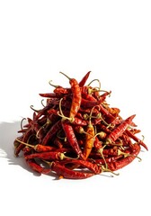 Fototapeta premium Heap of Dried Red Chili Peppers - A pile of dried red chili peppers on a white background. Perfect for adding spice to your designs!