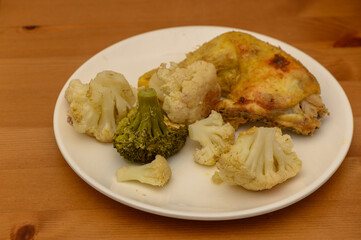 Oven-Baked Chicken with Cauliflower and Broccoli on Plate