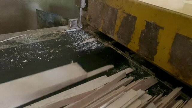 Automated Wood Cutting Process in a Manufacturing Setting.