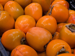 Close up of delicious fresh ripe persimmon fruits