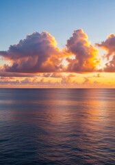 Obraz premium Serene Ocean Horizon Under a Golden Sky - A tranquil ocean reflects a vibrant sunrise. Symbolizing peace, hope, reflection, beauty, and vastness