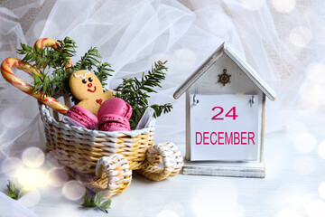 December 24 calendar: the number 24 and the month name "December" in English on a decorative calendar next to a sleigh