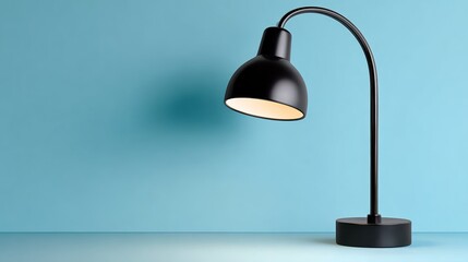 Modern black desk lamp with a curved neck, illuminating a minimalist workspace against a soft blue background, creating a serene and stylish atmosphere for productivity and creativity