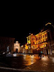 Atmospheric Night Scene of a Historic European Square with Golden Illumination