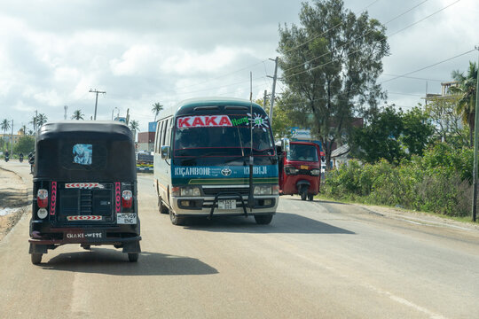 Dar Es Salaam, Tanzania - March 20 2026 -Editorial view of a tuk tuk navigating city streets, highlighting urban mobility and local transport culture.