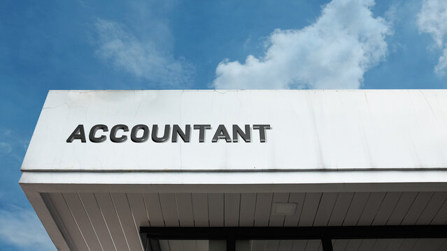 Accountant sign displayed on a building with blue sky background, creating a bright, clear, and modern exterior with professional and financial services atmosphere - Powered by Adobe